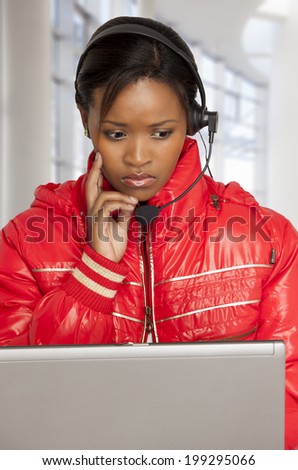 Young woman with telephone headset looking concerned.