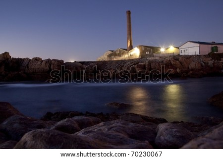 Old fish factory building, next to ocean, Lambert\'s Bay, Western Cape, South Africa.