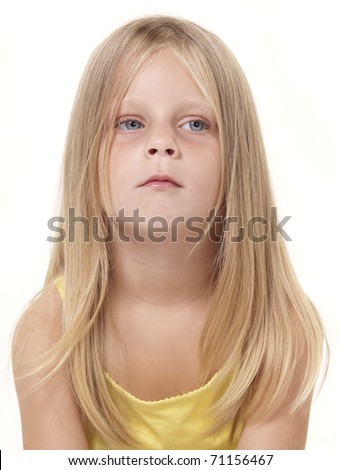 Young girl with a calm neutral, thoughtful expression.