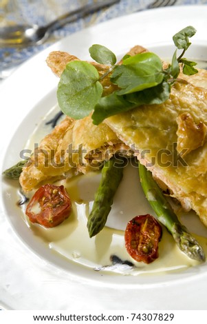 Delicious gourmet style chicken pie with asparagus and sun-ripened tomatoes, topped with basil