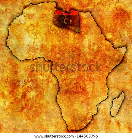 libya on actual vintage political map of africa with flags