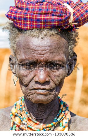 OMO VALLEY, ETHIOPIA - AUG 15: Erbore elder posing in the village,the ethnic groups in the The Omo valley Could disappear Because of Gibe III hydroelectric dam. on Aug 15, 2011 in Omo Valley, Ethiopia.