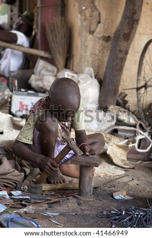 MALI - AUGUST 16: African Children work hard, forcing many children need to work from childhood in Mopti, August 16, 2009 in Mopti, Mali