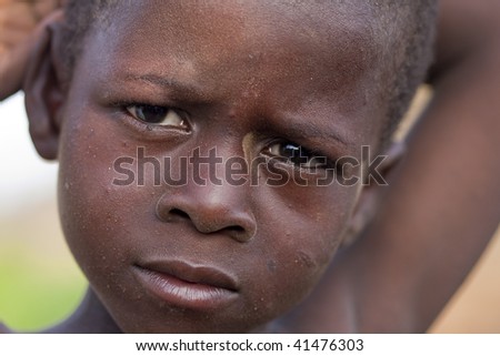 BURKINA FASO - AUGUST 9: Child Bissa ethnic posing, the Bissa represent 4% of the population of Burkina Faso, August 9, 2009 in Country Bissa, Burkina Faso