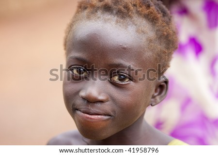 BURKINA FASO - AUGUST 13: Girl posing Senoufo, the Senoufo are an ethnic group that works as a community, all working together for the common good, August 13, 2009 in Country Senoufo, Burkina Faso