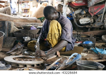 MALI - AUGUST 16: Man working at the port of Mopti, the port provides employment for much of the population, since it is the nation\'s largest, August 16, 2009 in Mopti, Mali