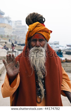 VARANASI - JANUARY 2: Sadhu in the river Ganges, a sadhu renunciation of all ties that unite with the earthly and material, and for the true values of life, January 2, 2010 in Varanasi, India