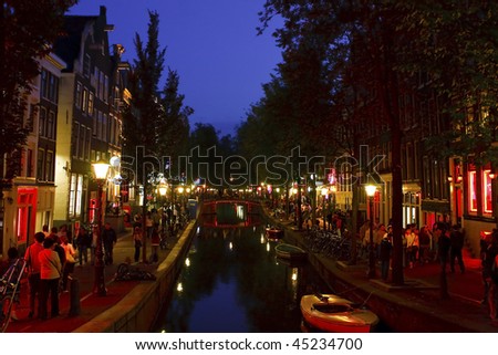 AMSTERDAM - AUGUST 4: Red lights district in the evening, today is the most visited streets of the old part of town, August 4, 2008 in Amsterdam, Netherlands