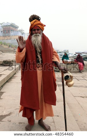 VARANASI - JANUARY 2: Sadhu in the river Ganges, a sadhu renunciation of all ties that unite with the earthly and material, and for the true values of life, January 2, 2010 in Varanasi, India
