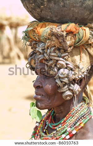 ETHIOPIA - AUG 15: Erbore elder posing in the village,the ethnic groups in the The Omo valley Could disappear Because of Gibe III hydroelectric dam. on Aug 15, 2011 in Omo Valley, Ethiopia.