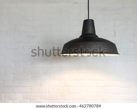 The Ceiling Fixture on brick wall background.