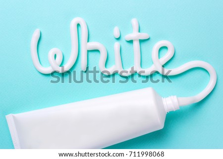 The word white is from the toothpaste. Tube for cleaning teeth and whitening