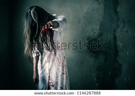 Girl zombie in the blood.The ghost of a woman reaches out and blood. horror of scary fear on hell is monster devil girl in halloween festival concept