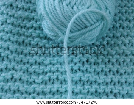 wool clew on knitted background
