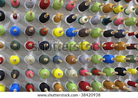 Cotton reels on a board in a factory