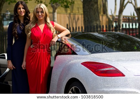 LONDON, UK - MAY 29: Cara Kilbey & Billi Mucklow from Towie pose for photos with a diamond encrusted Peugeot to celebrate the Jubilee on the MAY 29, 2012 in London, UK