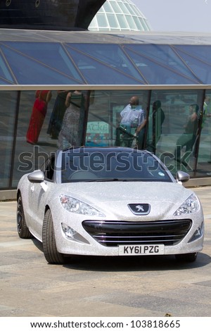 LONDON, UK - MAY 29:  Peugeot produce a car covered in hundreds of diamonds to celebrate the queens Jubilee on the MAY 29, 2012 in London, UK