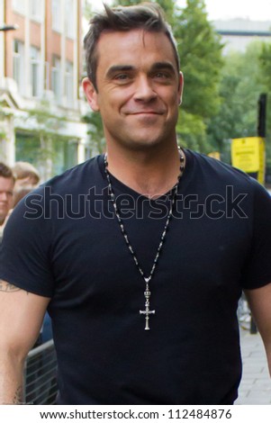 LONDON SEPT 10 Robbie Williams visits BBC Radio One Sept 10 2012 in London UK LONDON SEPT 10 Robbie Williams visits BBC Radio One Sept 10 2012 in London UK