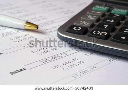 Image showing profit & loss calculations with pen & calculator