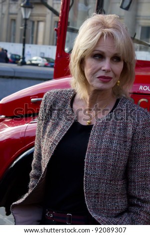 LONDON, UK - January 5 Actress Joanna Lumley poses in front of a Red London double decker in Trafalger Square London on the January 5, 2012 in London, UK