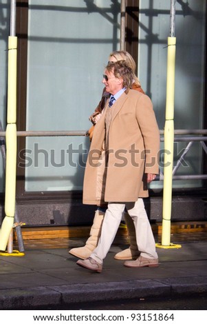 LONDON, UK - JANUARY 19: Rod Stewart & Penny Lancaster go for lunch in the west end on the January 19, 2012 in London, UK