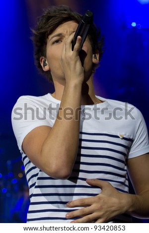 LONDON, UK - JAN. 23: Louis Tomlinson from One Direction Play the Apollo in London on the January 23, 2012 in London, UK