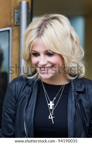 LONDON, UK - FEB. 01:Singer Pixie Lott signs autographs for fans out side the maida vale studios in London on the Feb 01, 2012 in London, UK