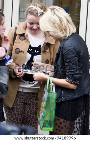 LONDON, UK - FEB. 01:Singer Pixie Lott signs autographs for fans out side the maida vale studios in London on the Feb 01, 2012 in London, UK