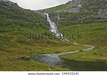 Big waterfall falling down the mountain side