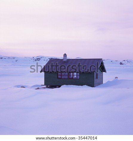 Lonely cabin in the snow