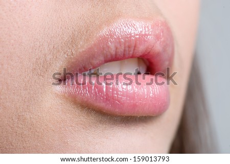 Close up shoot of young beautiful girl with perfect skin: makeup mouth zone. Lips.