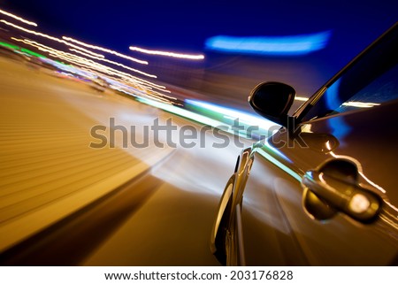 Car in motion at night