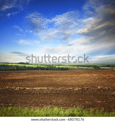 Plowed agricultural field with brown lowed soil