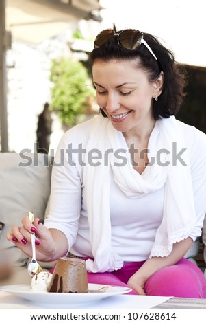 Very cute smiling women, sitting outside