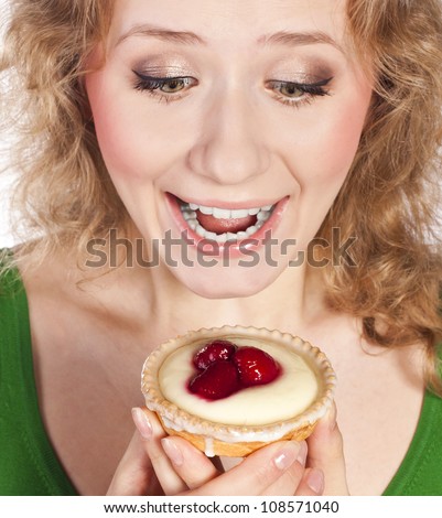 Young beautiful blonde ,and cake in the studio ,on a white background