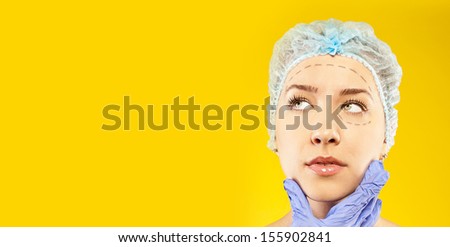 young woman thinks to have surgery or not. your text here