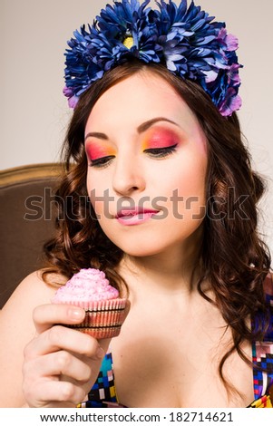 beautiful smiling young woman with cake