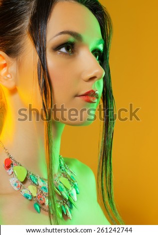 Studio portrait of gorgeous model on a yellow background in the studio