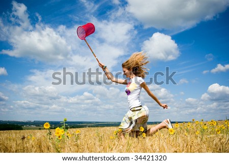stock photo : Young girl running with a butterfly net