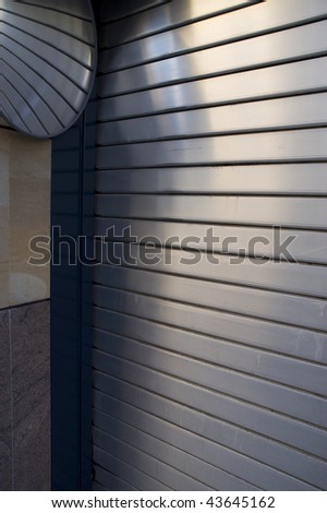 Roller shutter garage door with mirror
