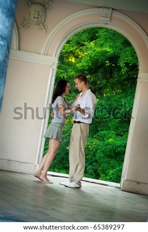 couple dancing in old park theater