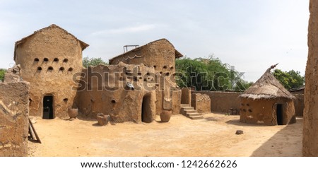 Traditional mud built houses in Gaoui, Chad N\'Djamena. Old ancient houses, located in Sahel desert and Sahara. Hot weather in desert climate on the Chari river.