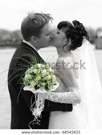 The groom kisses the bride.