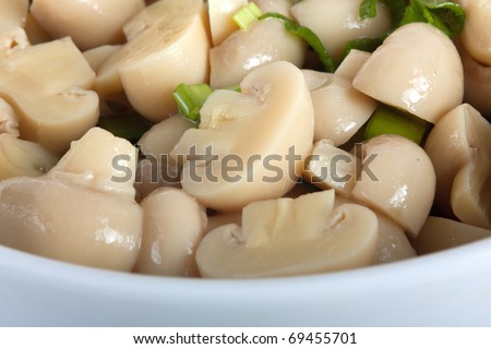 Pickled mushrooms salad with spring onion and oil