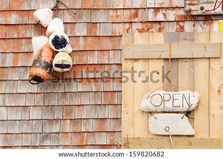 Open sign on craft store in Peggys Cove, Nova Scotia