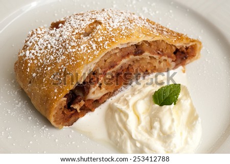 Traditional apple strudel with ice cream in Vienna cafe