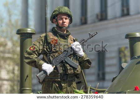 SEVASTOPOL, CRIMEA - MAY 9: The Victory Day parade of veterans and Russian military in honor of 70th anniversary on May 9, 2015 in downtown Sevastopol, Crimea. Crew of BTR-80 is greeted by the crowd.