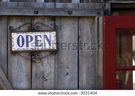 Open sign on spanish tiles, wooden door, St. Augustine, Florida