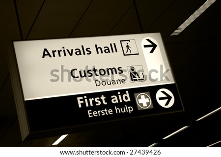 Directional sign in arrivals hall of Amsterdam airport