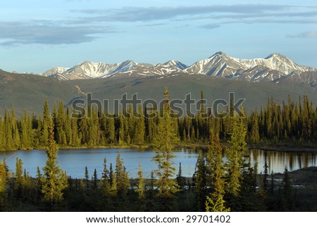 Pristine lake and mountain range in Alaska